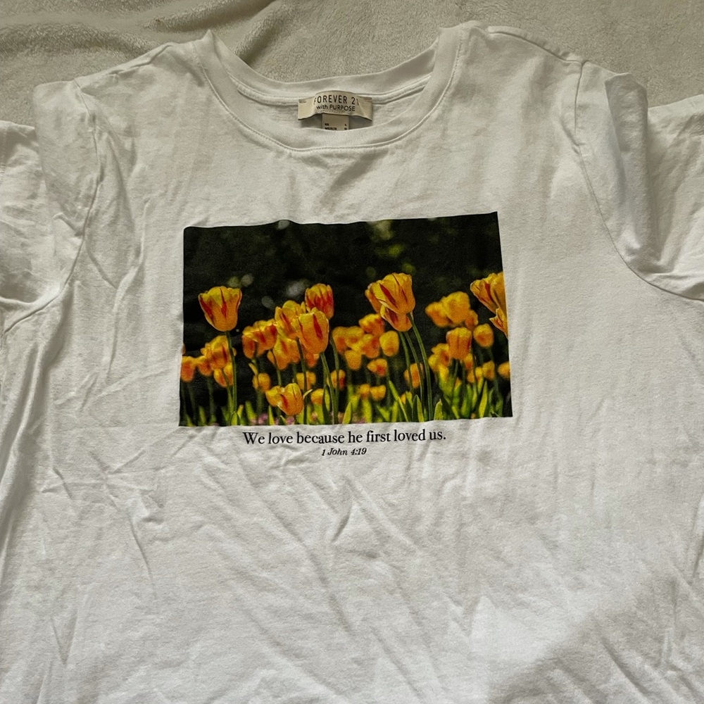 “We love because He first loved us” Tee